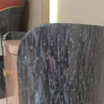 Curved High-Gloss Nightstand with Textured Drawer Panels and Oval Pulls